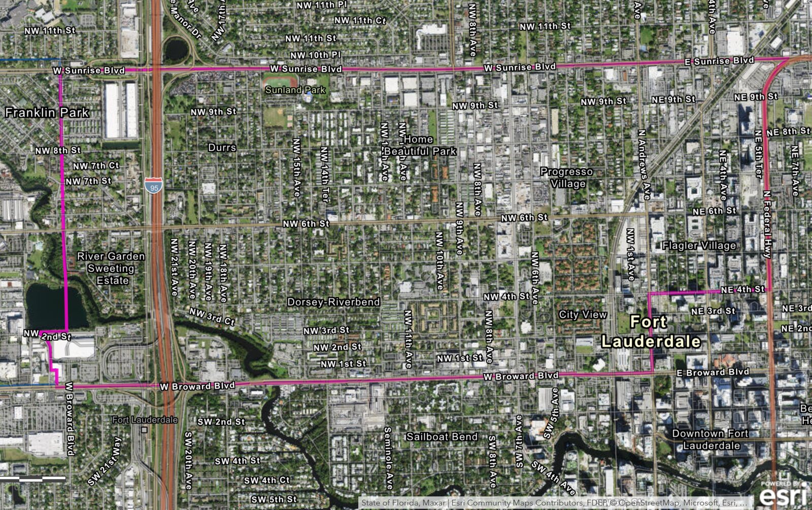Aerial of the CRA showing the east-west divide: active reinvestment near the eastern edge, the western core still underbuilt. BusinessFlare® / Esri.